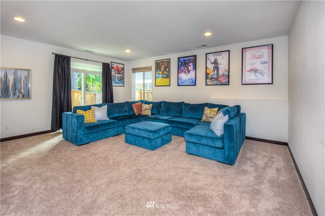 17503 3rd Avenue Southeast Bothell, WA 98012 - Photo 19 of 22 a living room with furniture and a wooden floor