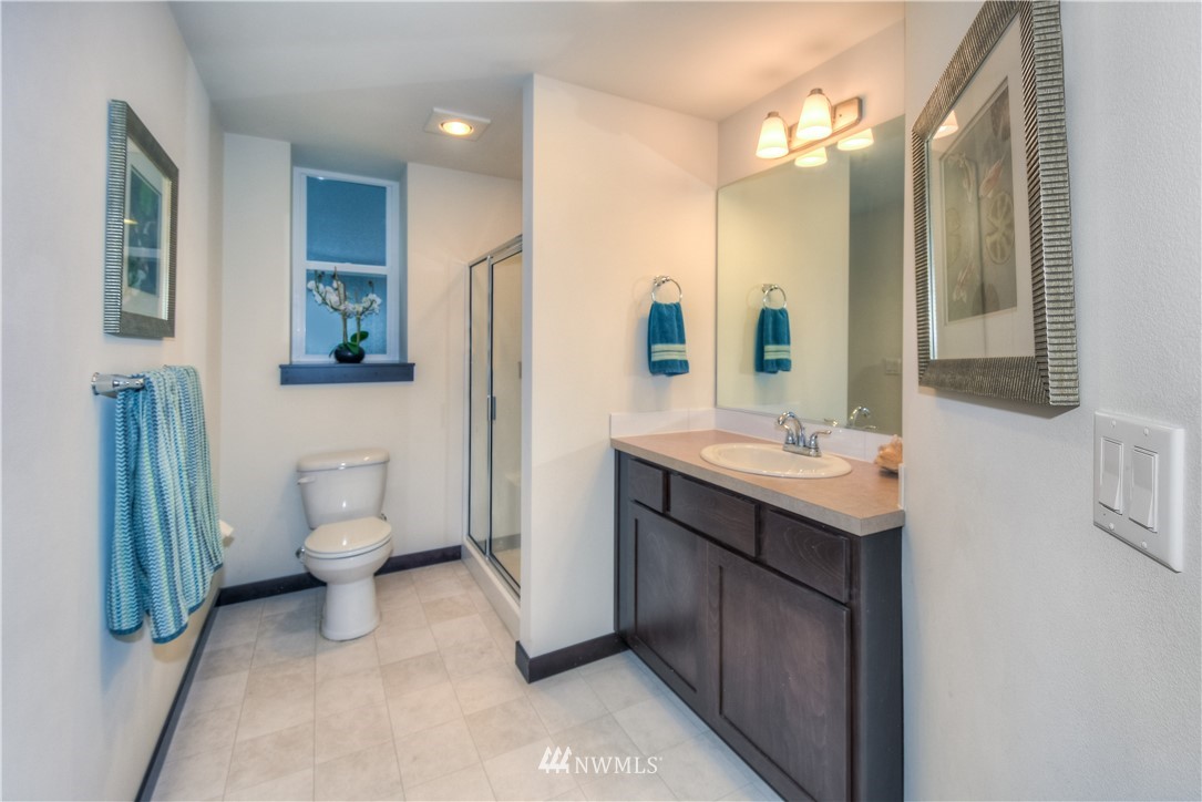 17503 3rd Avenue Southeast Bothell, WA 98012 - Photo 20 of 22 a bathroom with a sink a toilet and mirror