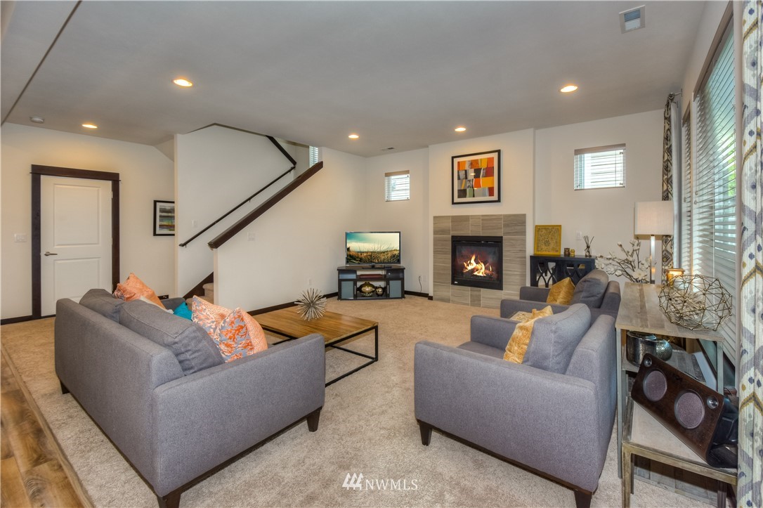 17503 3rd Avenue Southeast Bothell, WA 98012 - Photo 6 of 22 a living room with furniture and a fireplace