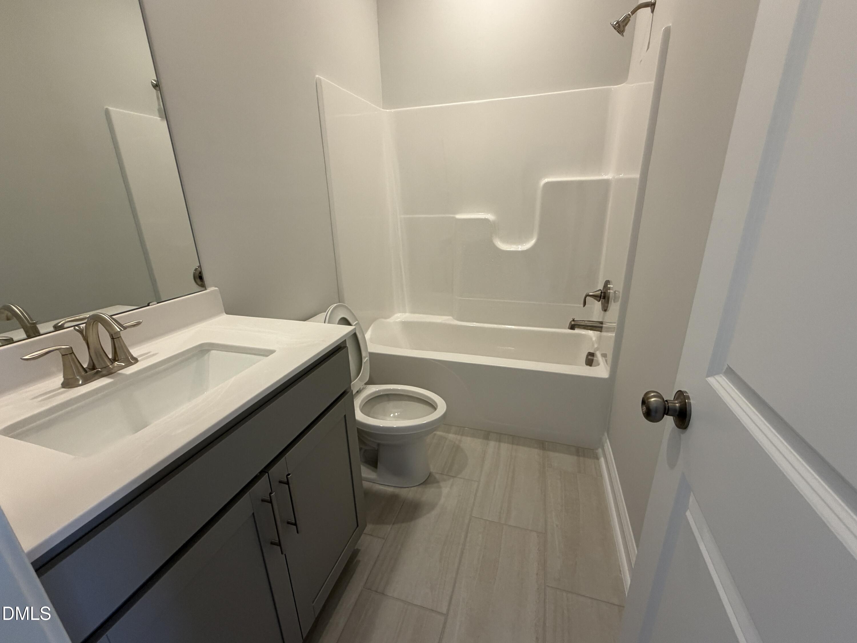 3016 Sandy Bluff Road Raleigh, NC 27616 - Photo 29 of 34 a bathroom with a sink a toilet and shower