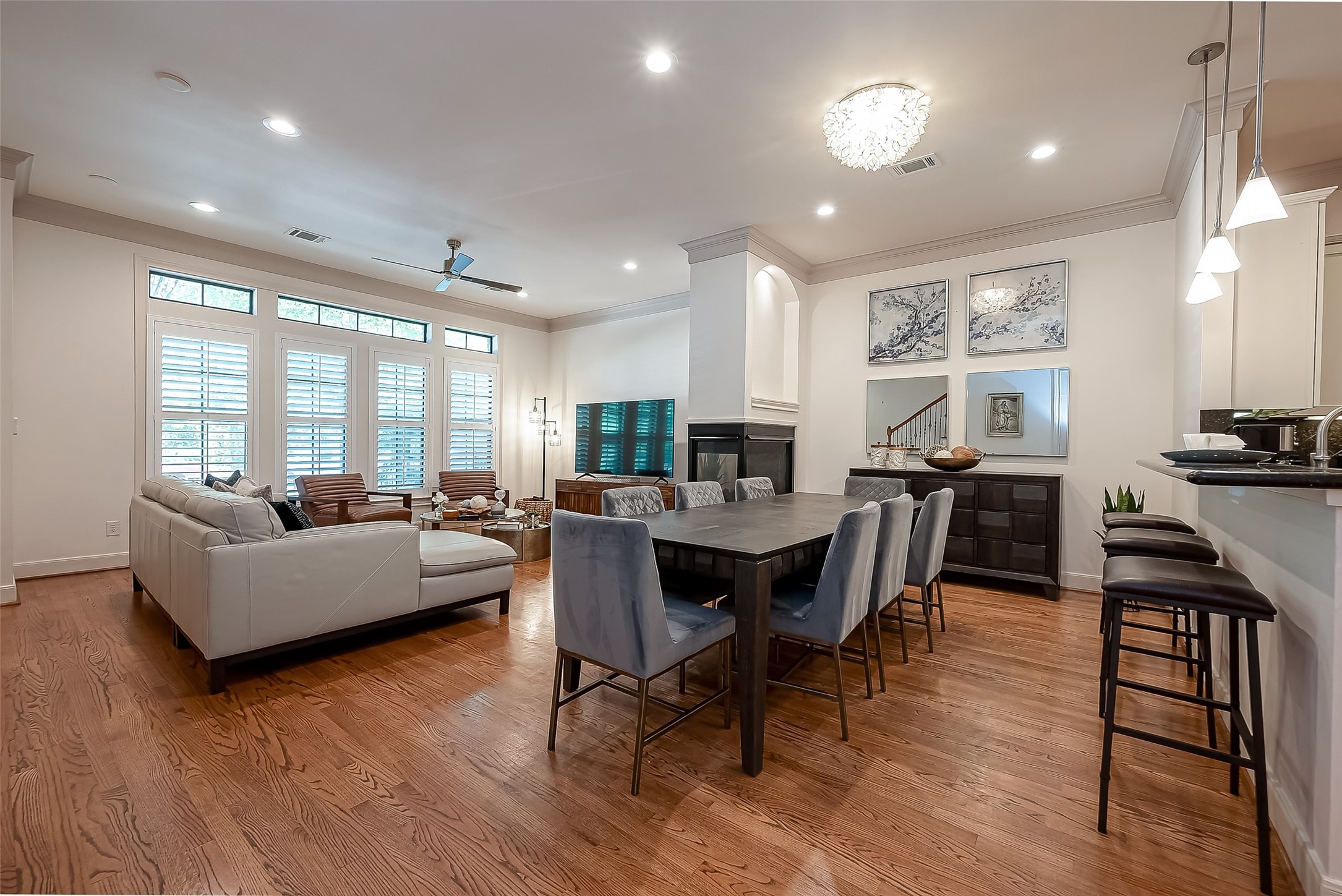 56 Riva Row The Woodlands, TX 77380 - Photo 12 of 36 a living room with furniture a large window and wooden floor