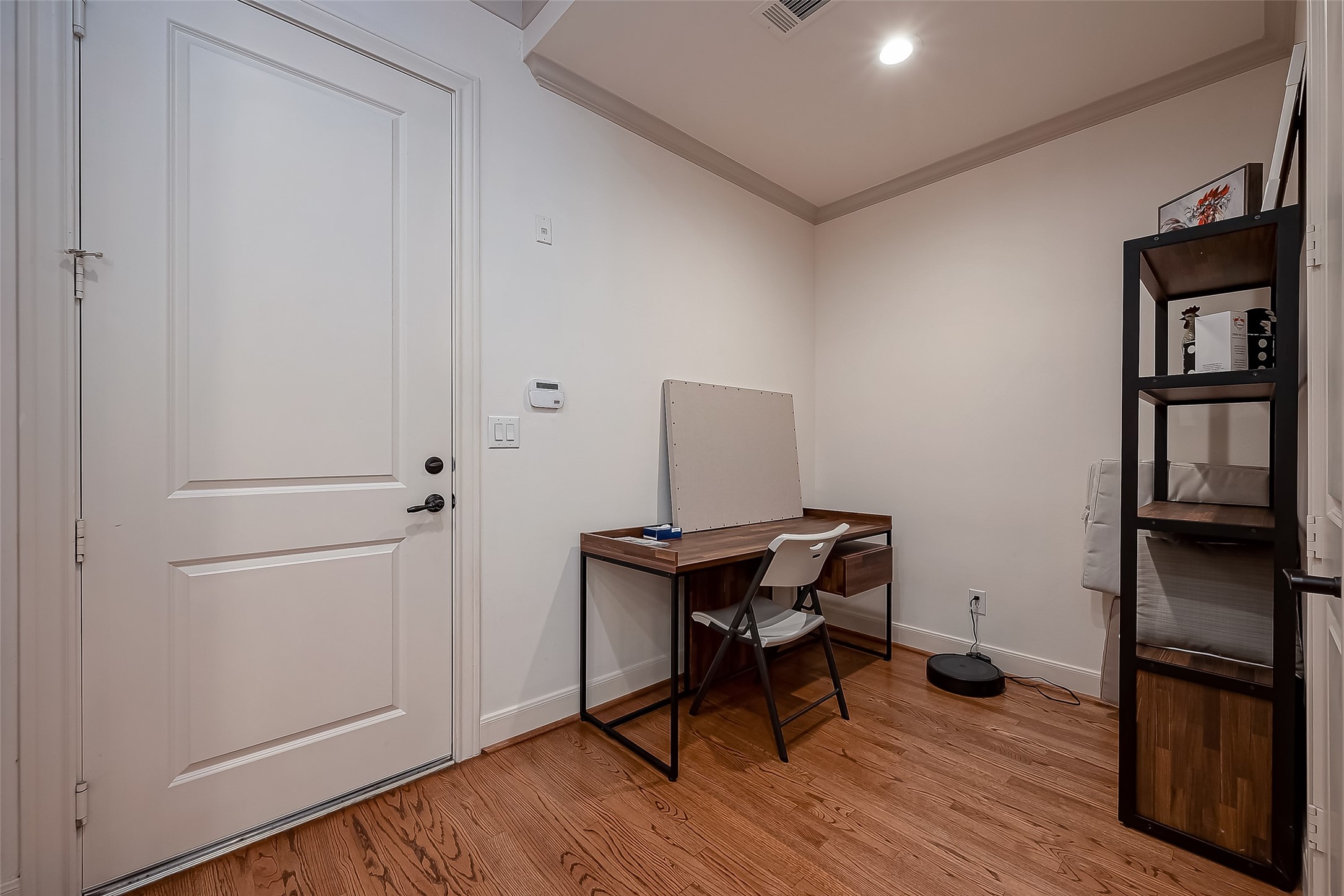 56 Riva Row The Woodlands, TX 77380 - Photo 14 of 36 a view of a workspace with furniture and wooden floor
