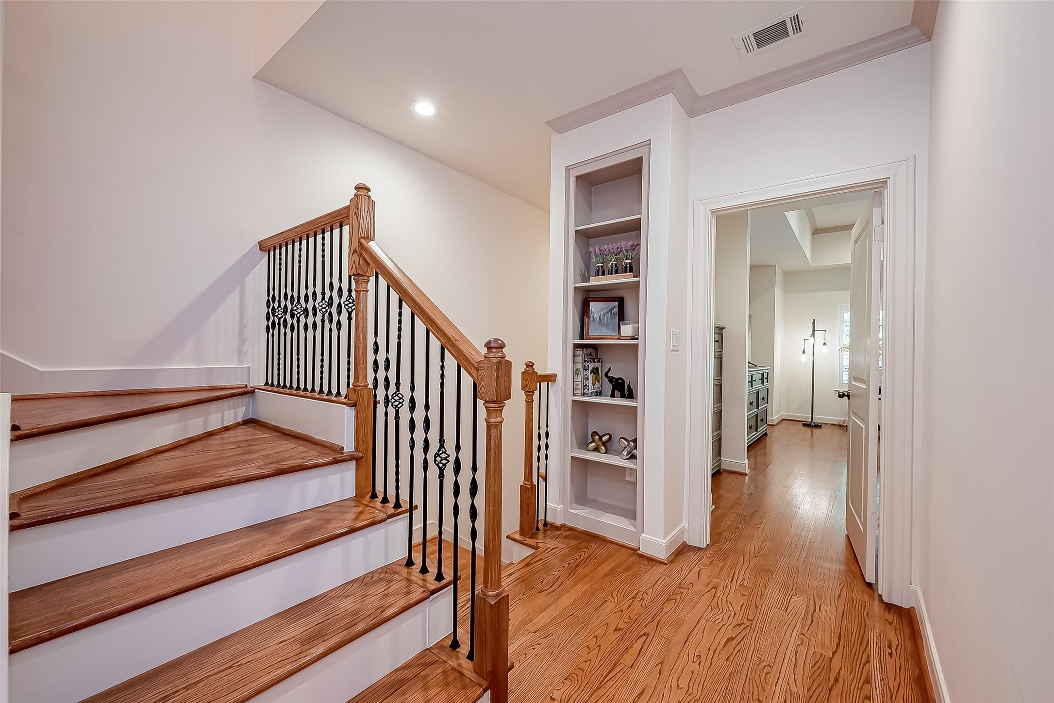56 Riva Row The Woodlands, TX 77380 - Photo 20 of 36 a view of entryway and hall with wooden floor
