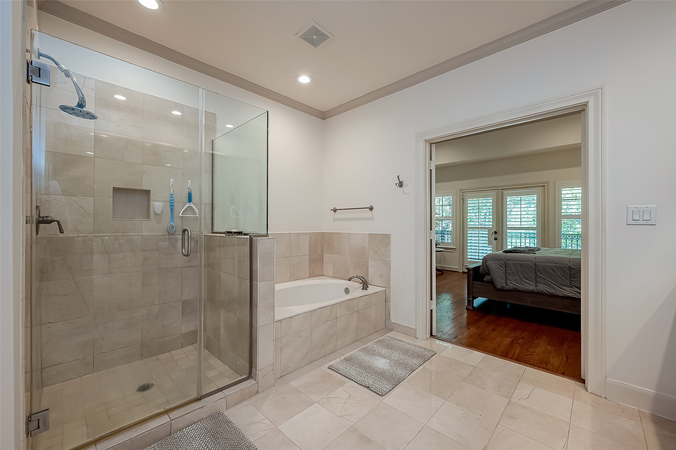 56 Riva Row The Woodlands, TX 77380 - Photo 26 of 36 a en suite bathroom with a granite countertop tub shower and sink