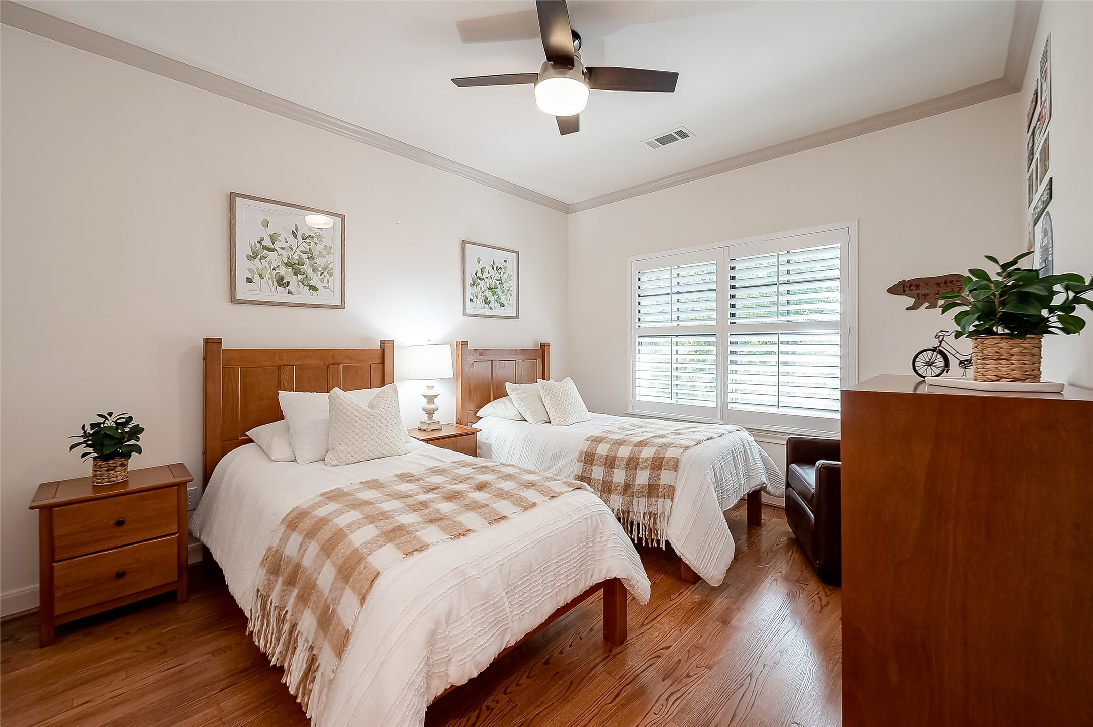 56 Riva Row The Woodlands, TX 77380 - Photo 29 of 36 a bedroom with two beds and a potted plant