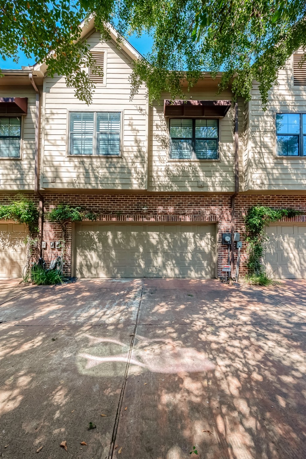 56 Riva Row The Woodlands, TX 77380 - Photo 35 of 36 a view of a house with a yard