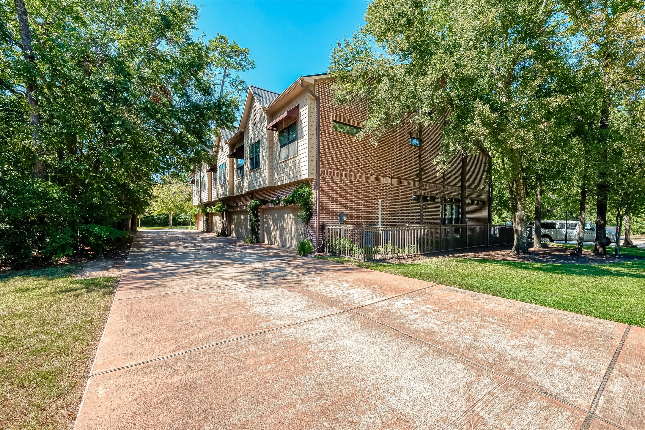 56 Riva Row The Woodlands, TX 77380 - Photo 36 of 36 a view of a street with brick building in the background