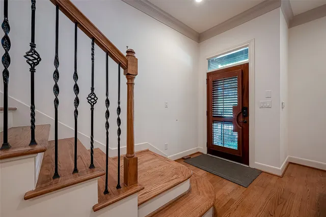 a view of front door with staircase