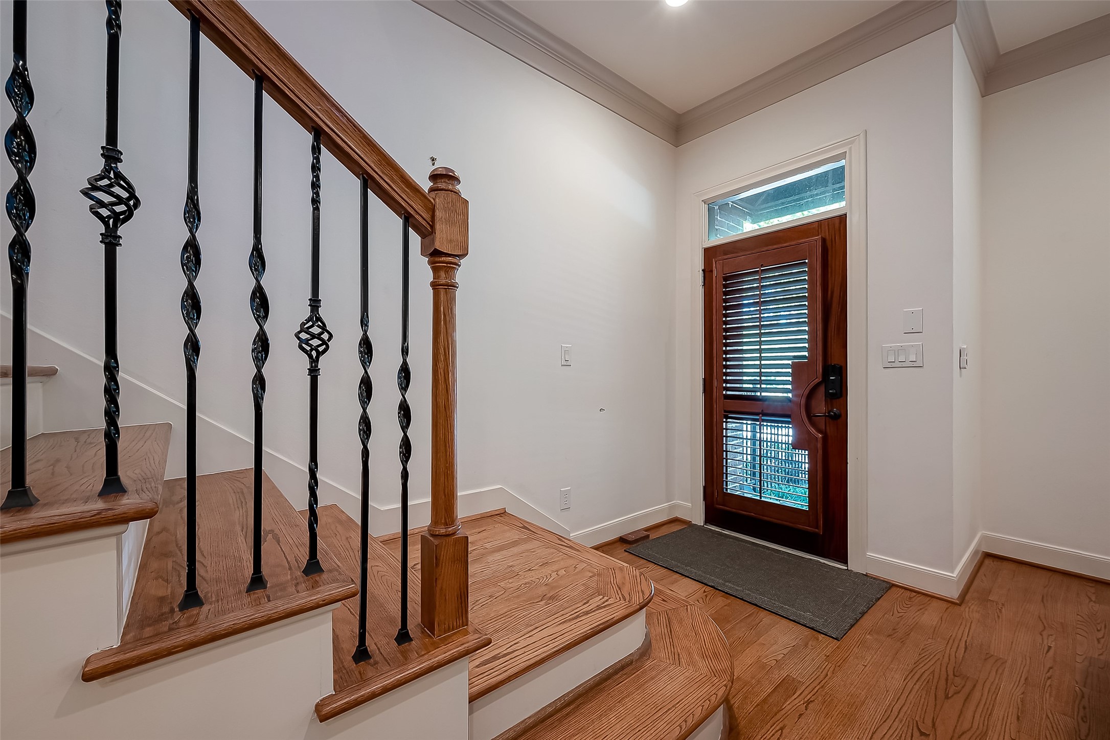 56 Riva Row The Woodlands, TX 77380 - Photo 4 of 36 a view of front door with staircase