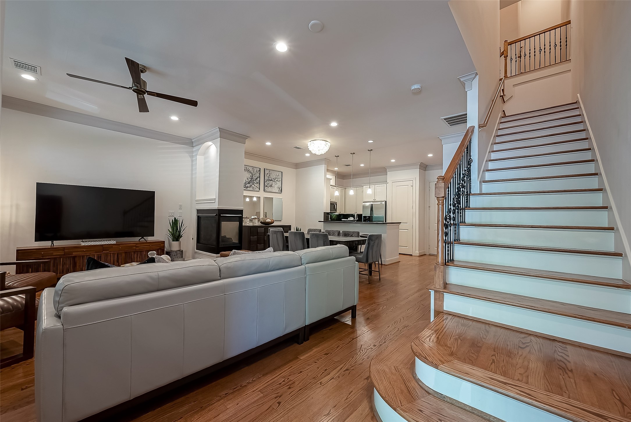 56 Riva Row The Woodlands, TX 77380 - Photo 5 of 36 a living room with furniture and a flat screen tv