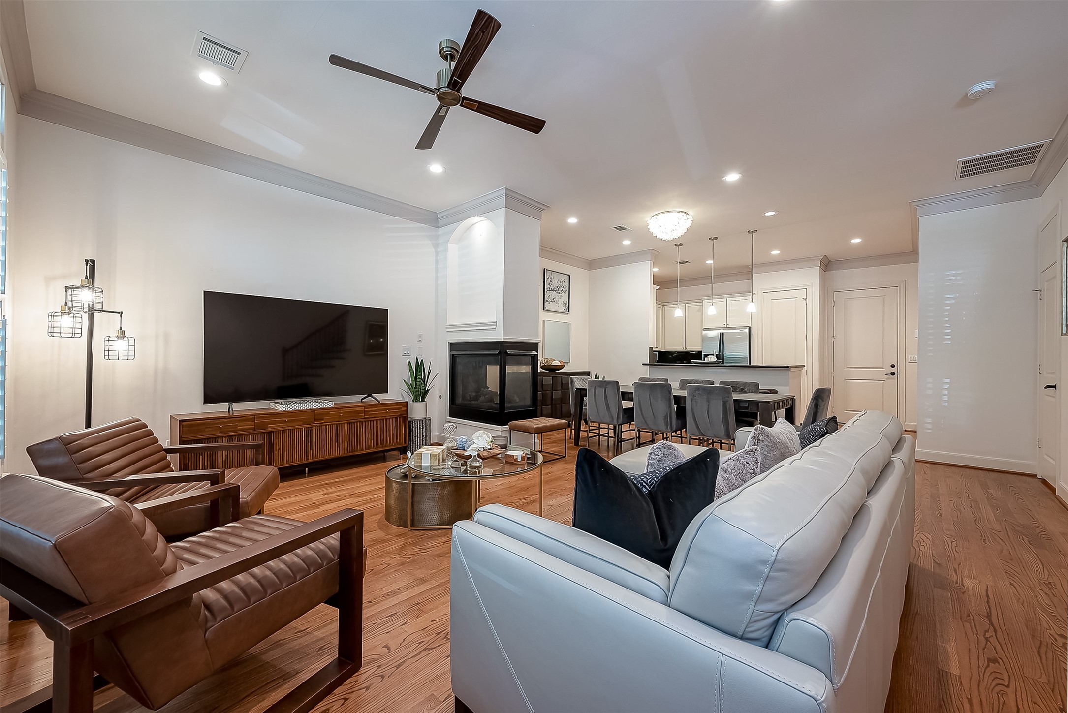 56 Riva Row The Woodlands, TX 77380 - Photo 6 of 36 a living room with furniture and a flat screen tv