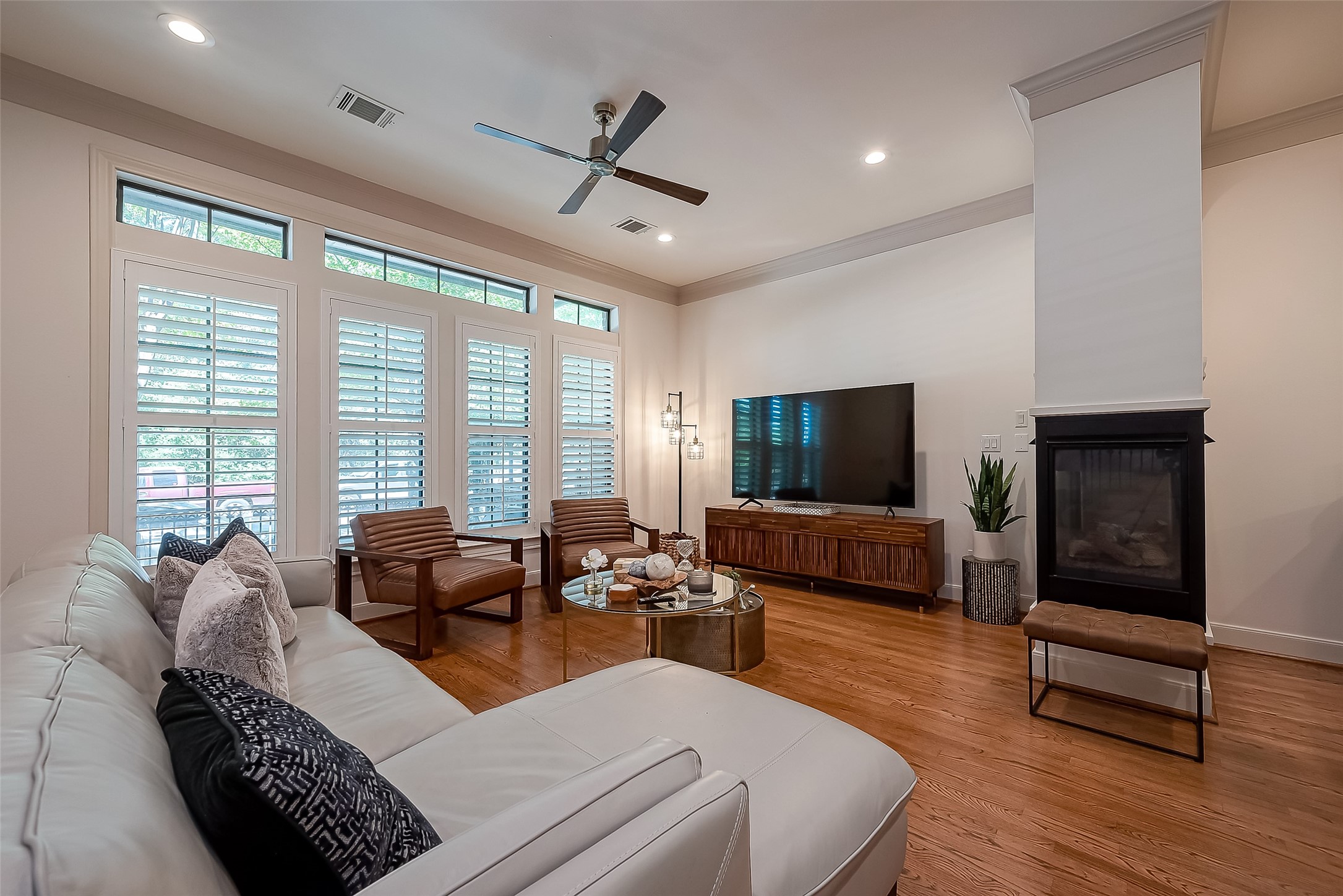 56 Riva Row The Woodlands, TX 77380 - Photo 10 of 36 a living room with furniture and a flat screen tv