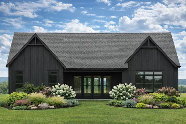 a front view of house with a garden