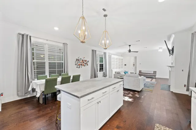 a view of a deck with couches chairs with wooden floor