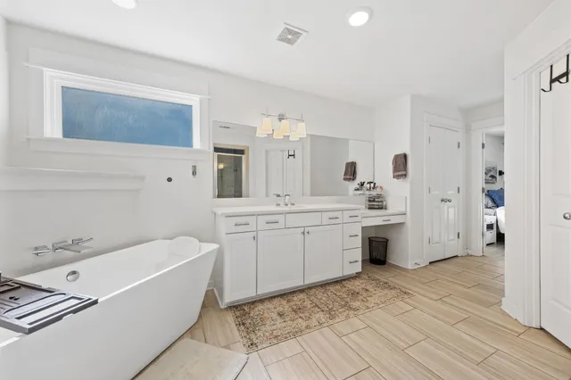 a bathroom with a sink a mirror and shower