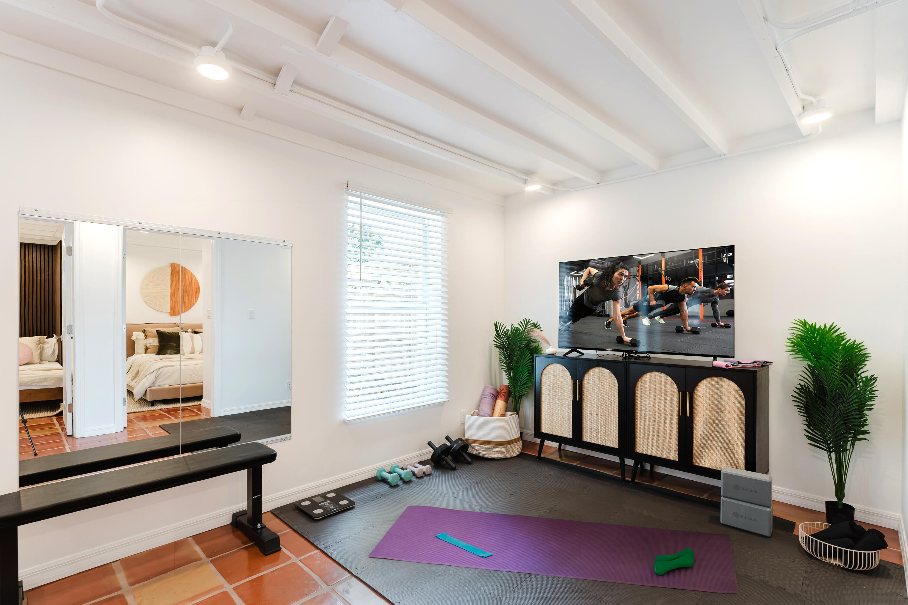 921 Ortega Road West Palm Beach, FL 33405 - Photo 32 of 60 a room with gym equipment and a large window