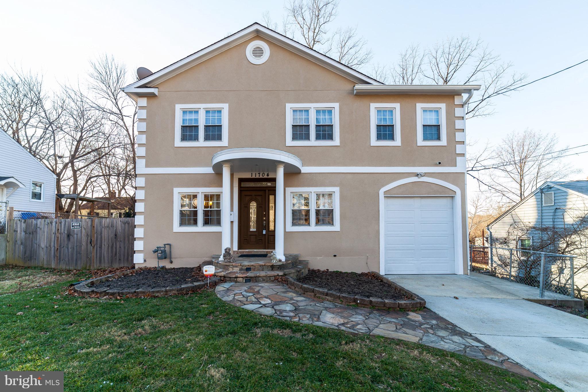 11704 Goodloe Road Silver Spring, MD 20906 - Photo 1 of 30 a front view of a house with a yard