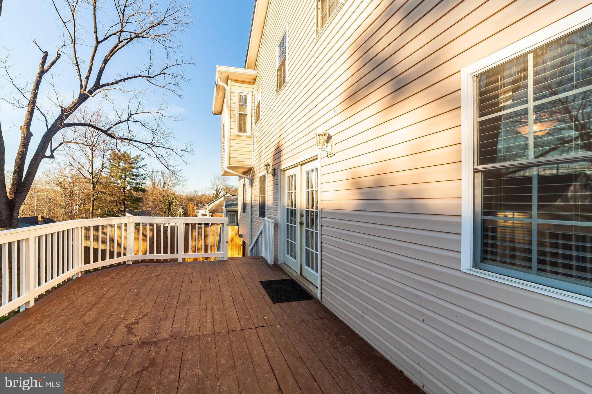 11704 Goodloe Road Silver Spring, MD 20906 - Photo 2 of 30 a view of a balcony with wooden floor and fence