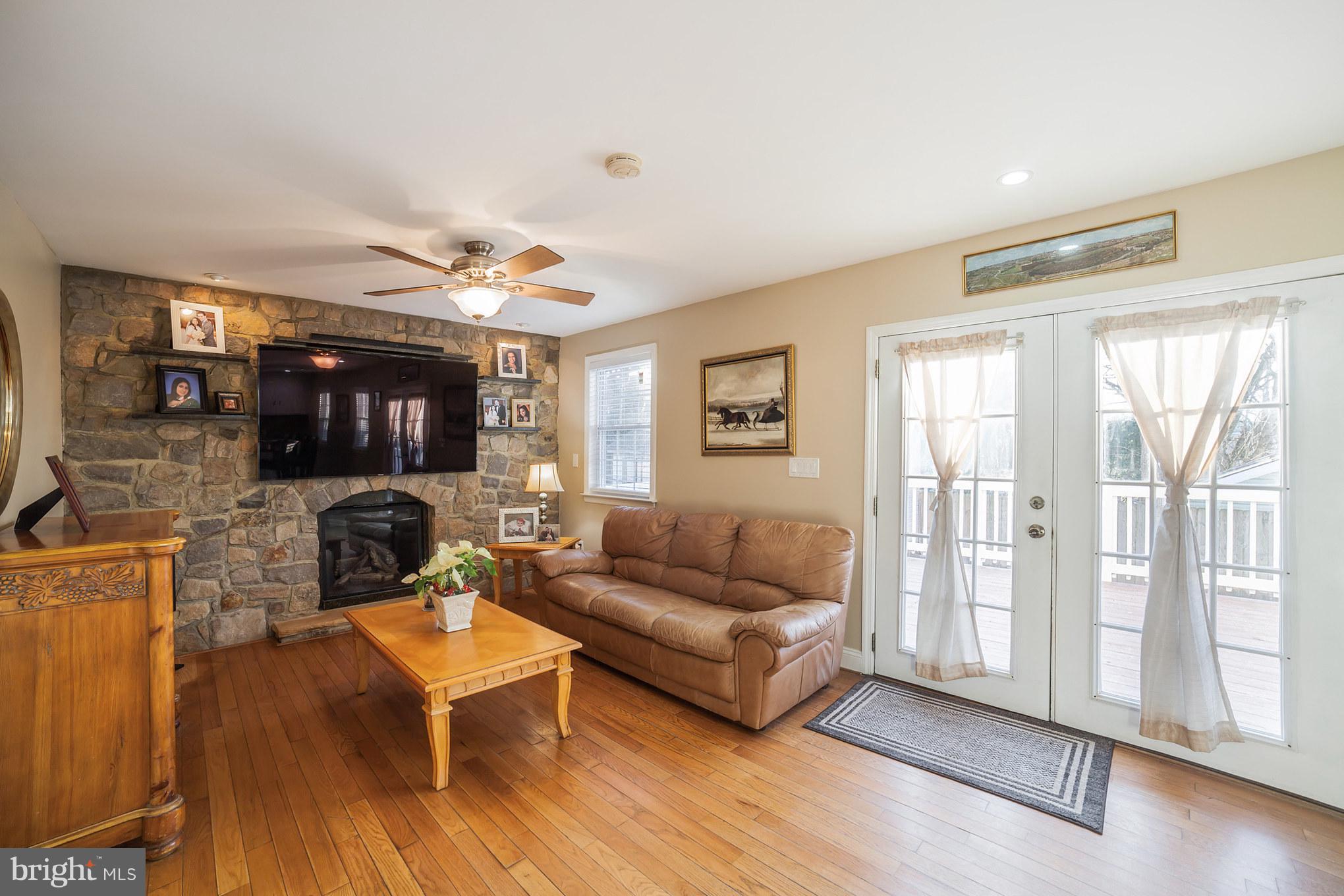11704 Goodloe Road Silver Spring, MD 20906 - Photo 11 of 30 a living room with furniture and a large window