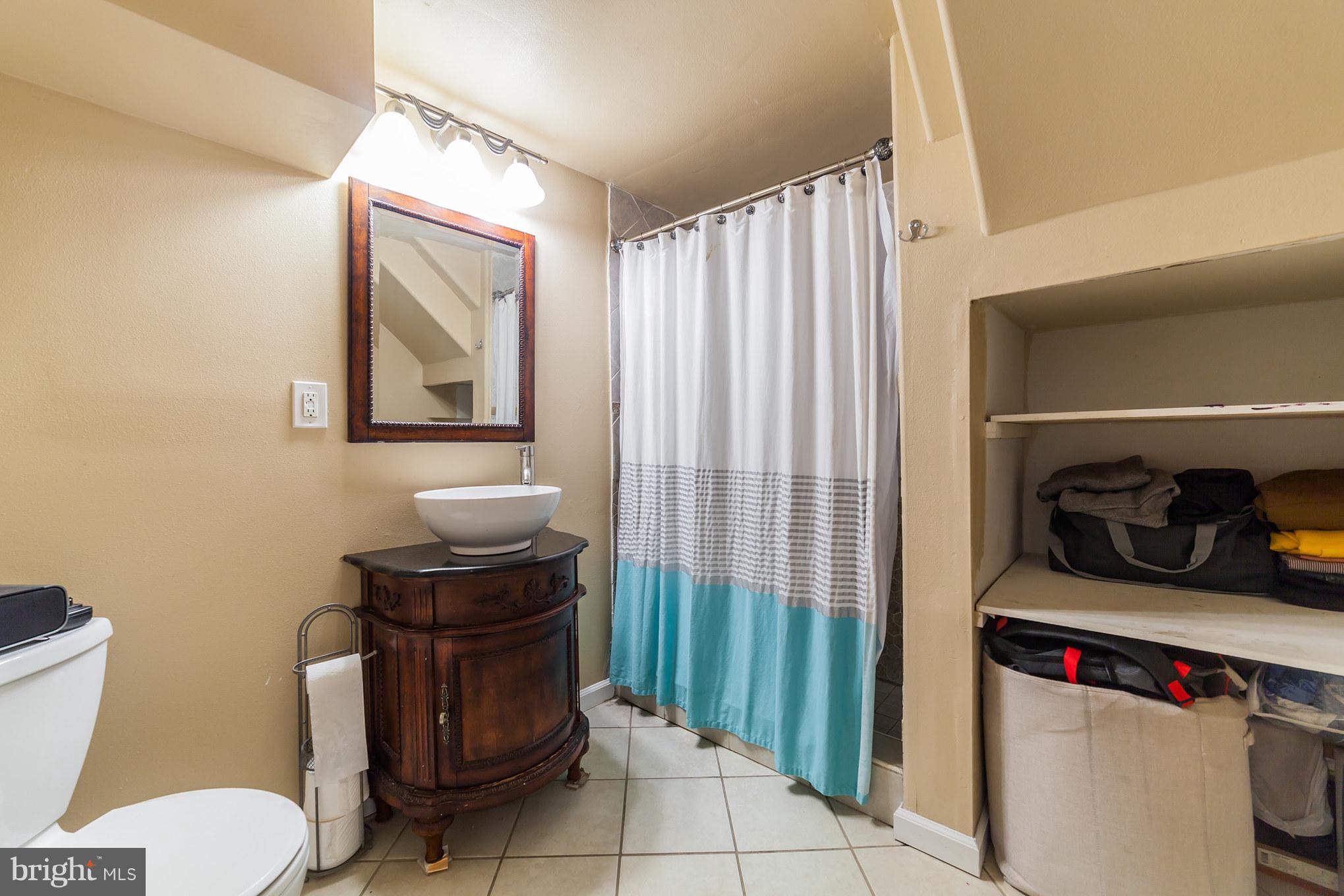 11704 Goodloe Road Silver Spring, MD 20906 - Photo 16 of 30 a bathroom with a toilet and a sink