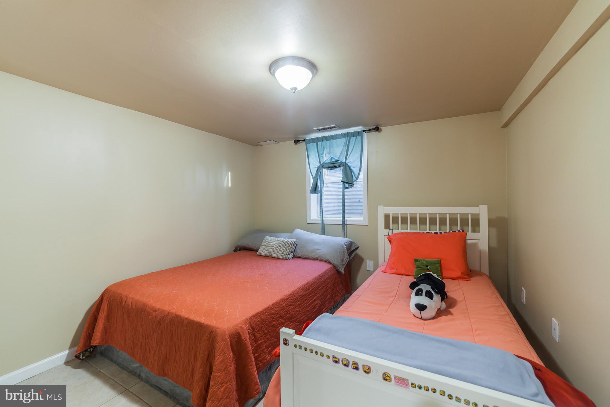 11704 Goodloe Road Silver Spring, MD 20906 - Photo 17 of 30 a bedroom with bed and a window