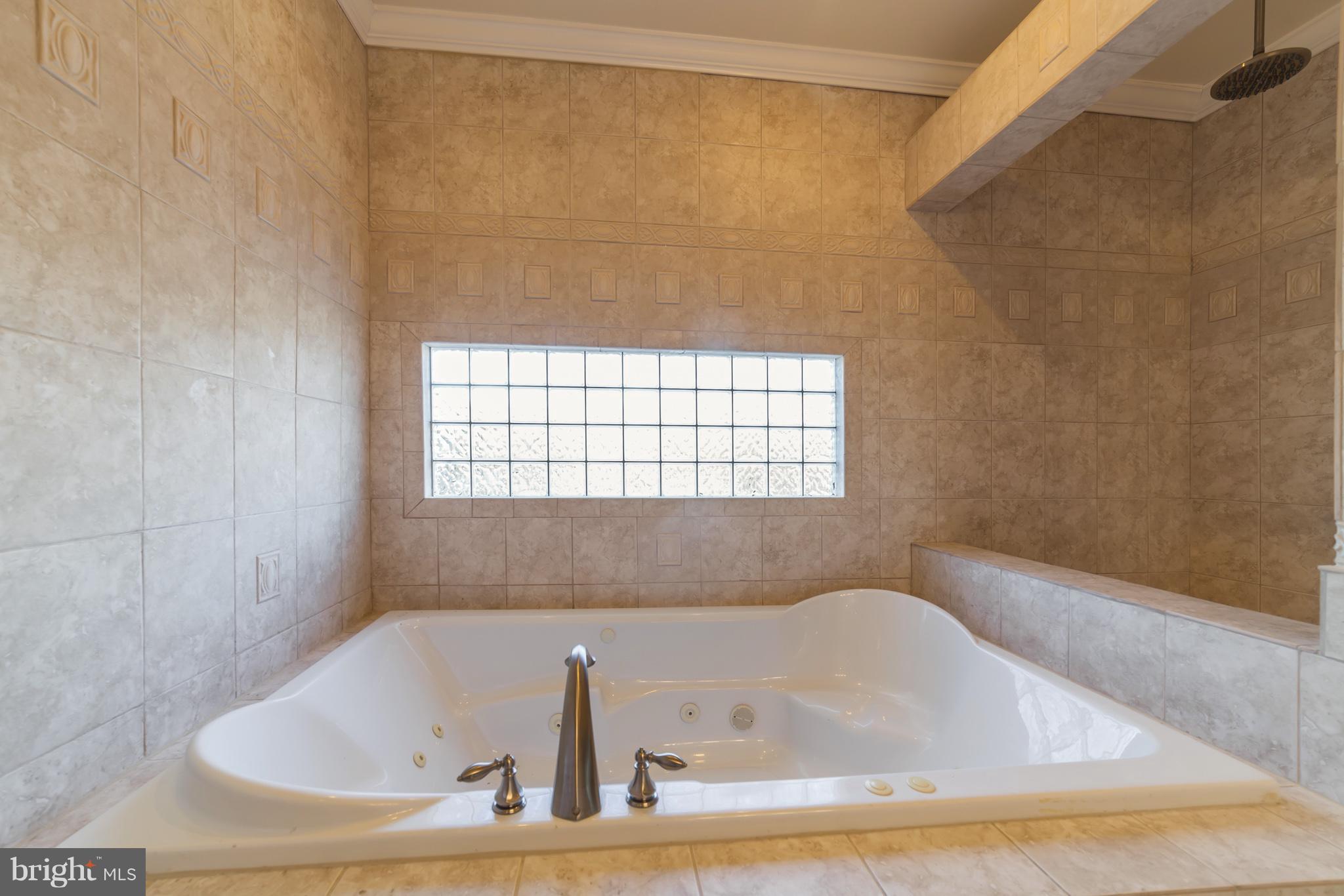 11704 Goodloe Road Silver Spring, MD 20906 - Photo 25 of 30 a bathroom with a bathtub