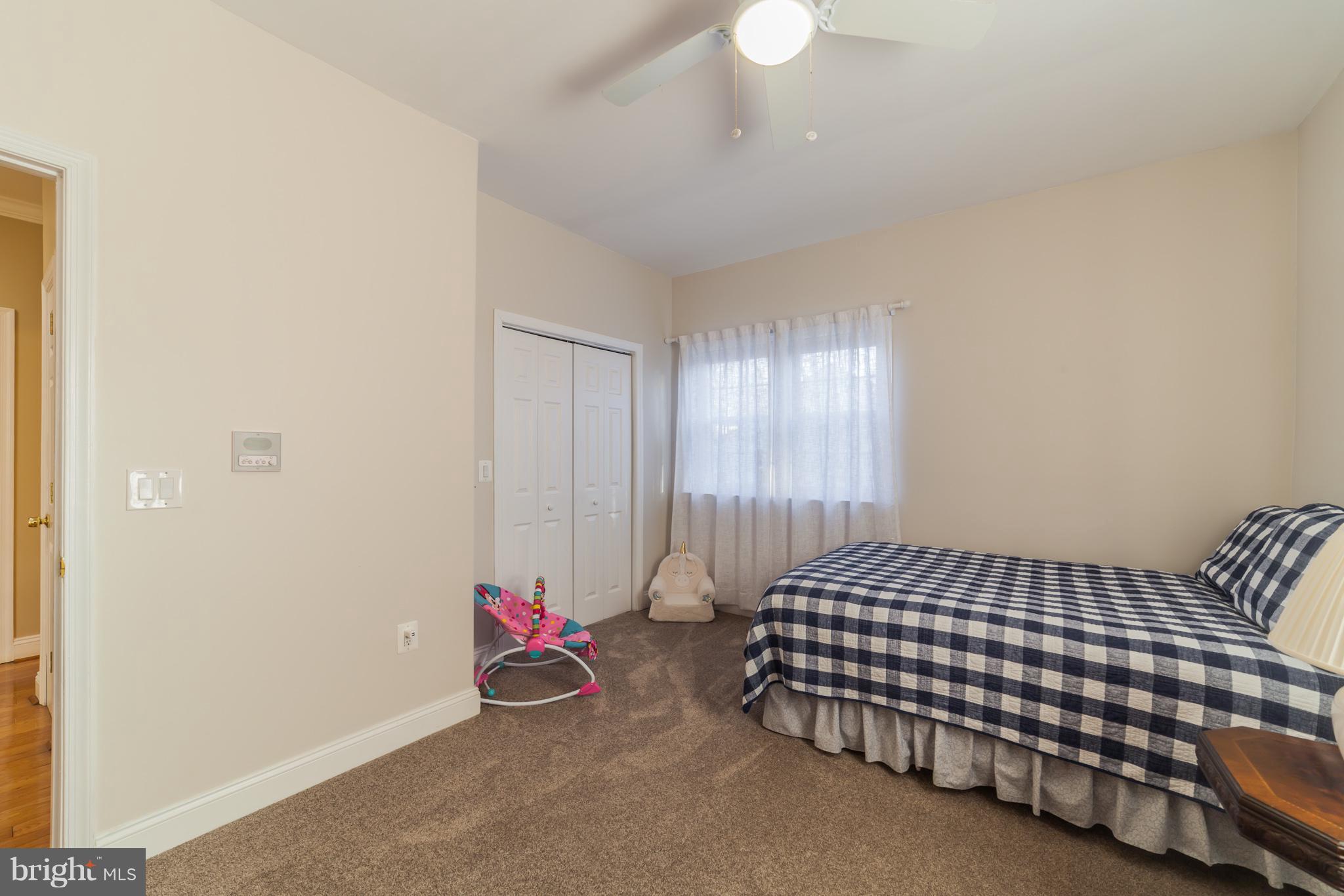 11704 Goodloe Road Silver Spring, MD 20906 - Photo 27 of 30 a bedroom with bed and window