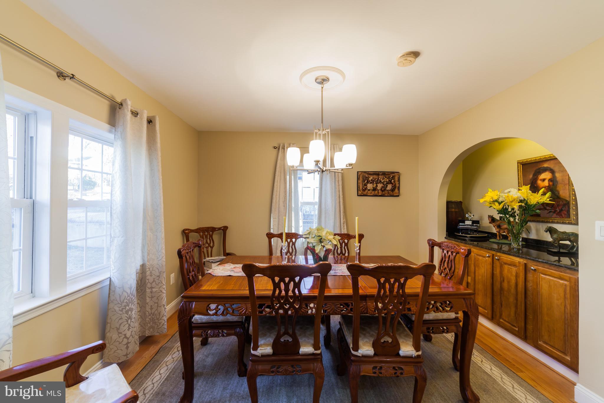 11704 Goodloe Road Silver Spring, MD 20906 - Photo 7 of 30 a view of a dining room with furniture window and wooden floor
