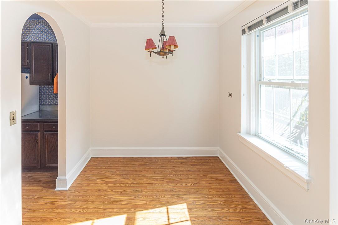 270 Bronxville Road, Unit B63 Bronxville, NY 10708 - Photo 11 of 25 a view of a room with wooden floor and windows