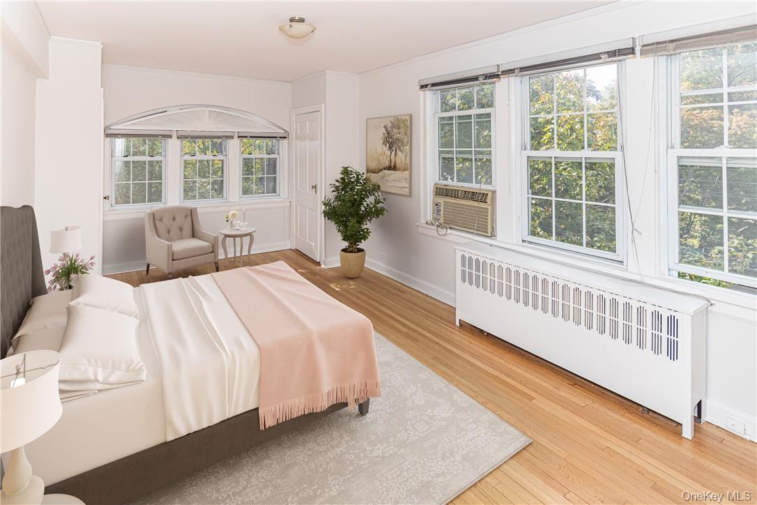 270 Bronxville Road, Unit B63 Bronxville, NY 10708 - Photo 14 of 25 a bedroom with a bed and a large window