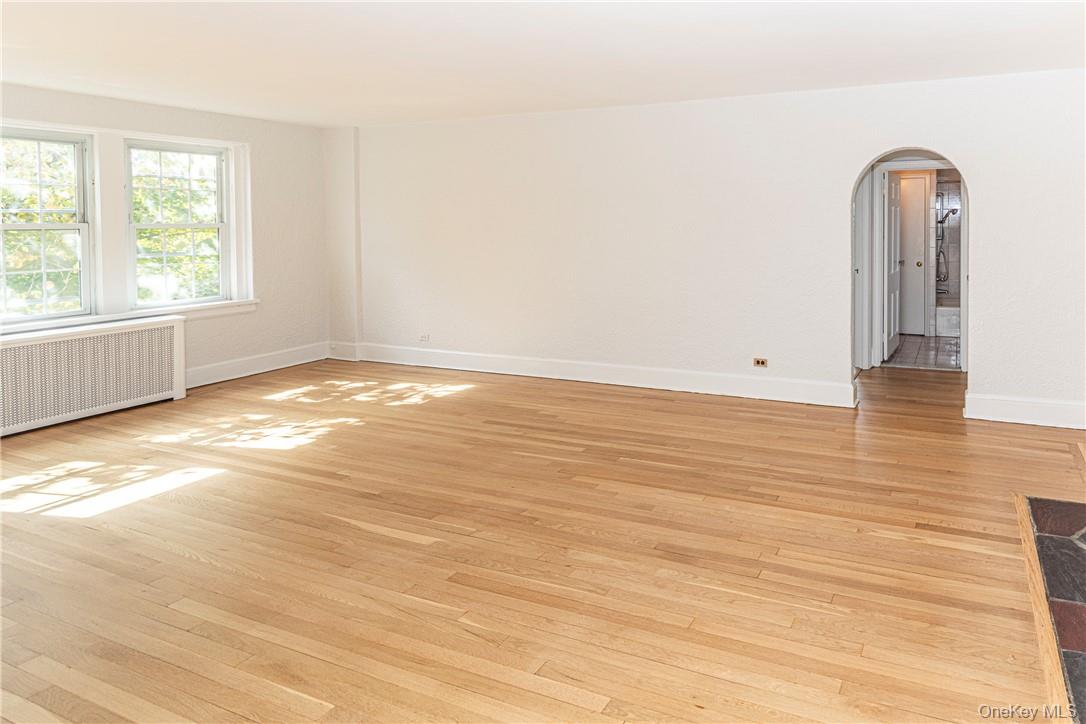 270 Bronxville Road, Unit B63 Bronxville, NY 10708 - Photo 22 of 25 an empty room with wooden floor and windows
