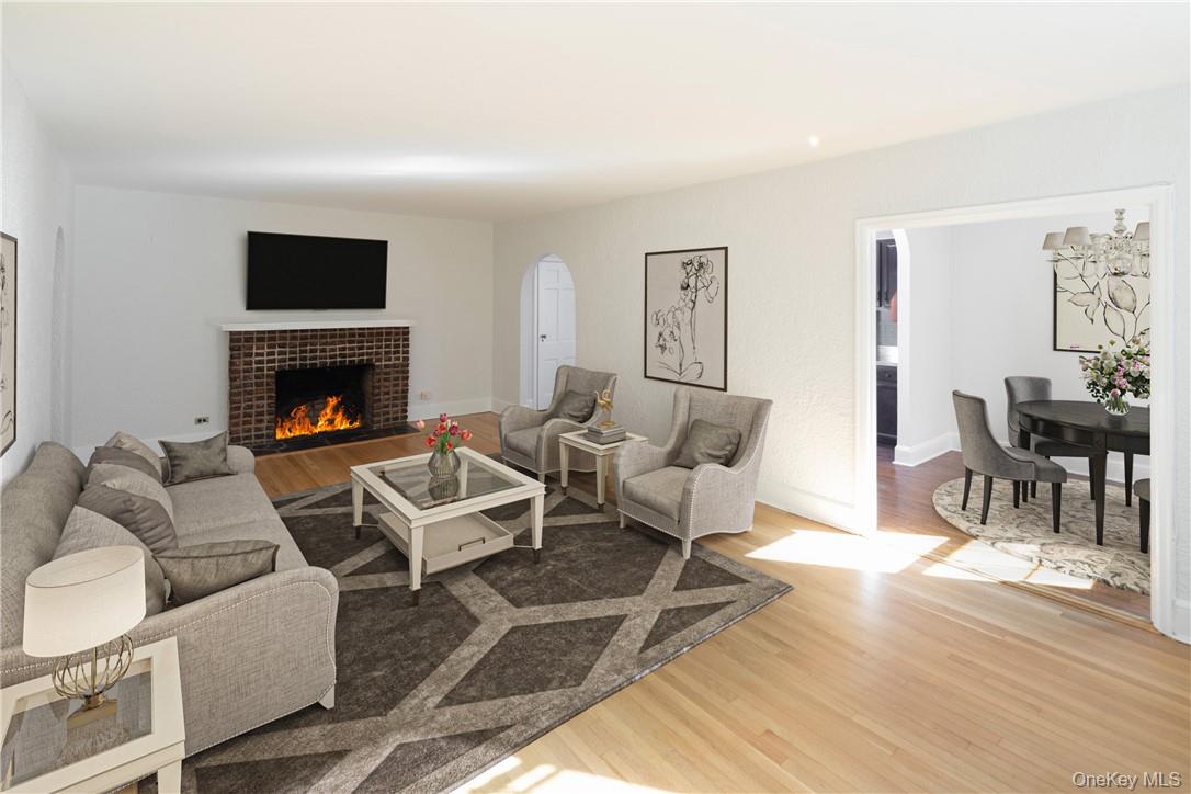 270 Bronxville Road, Unit B63 Bronxville, NY 10708 - Photo 4 of 25 a living room with furniture fireplace and wooden floor