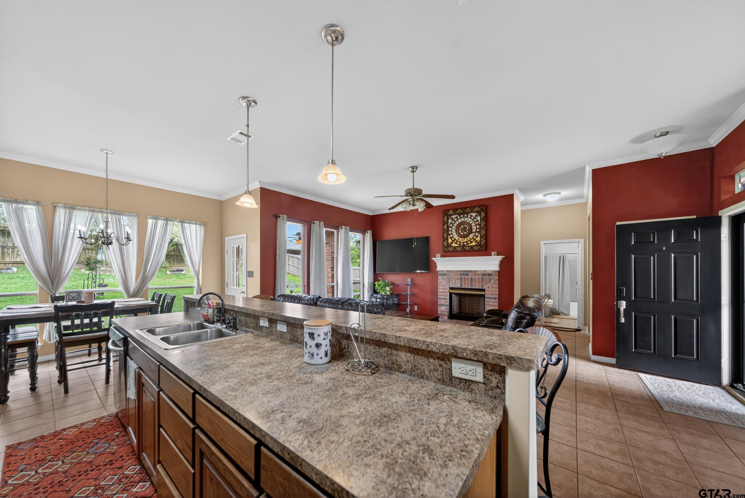 11274 Meadows Drive Flint, TX 75762 - Photo 11 of 43 a view of a kitchen with granite countertop a stove and a sink