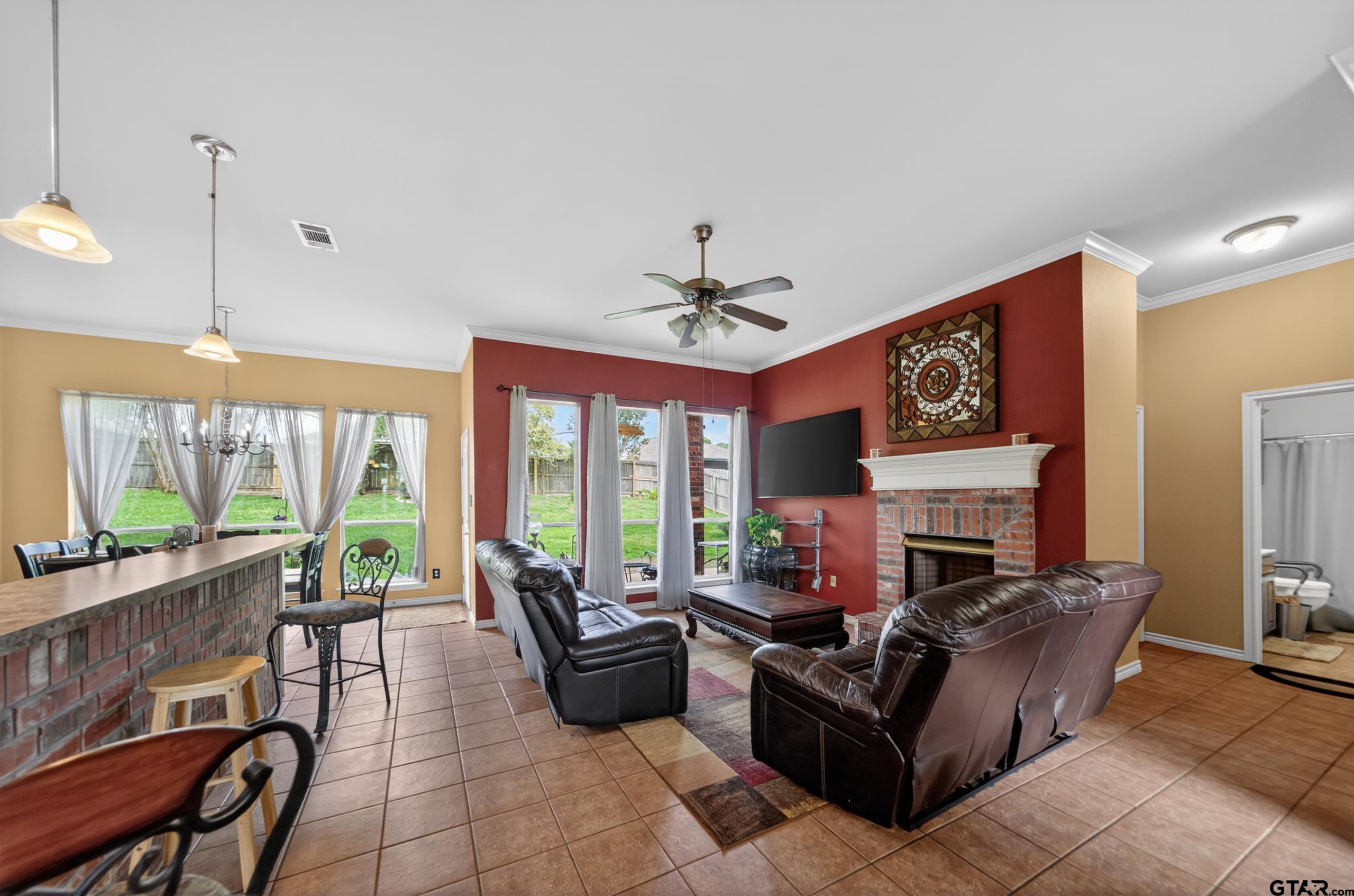 11274 Meadows Drive Flint, TX 75762 - Photo 14 of 43 a living room with furniture a flat screen tv and a large window
