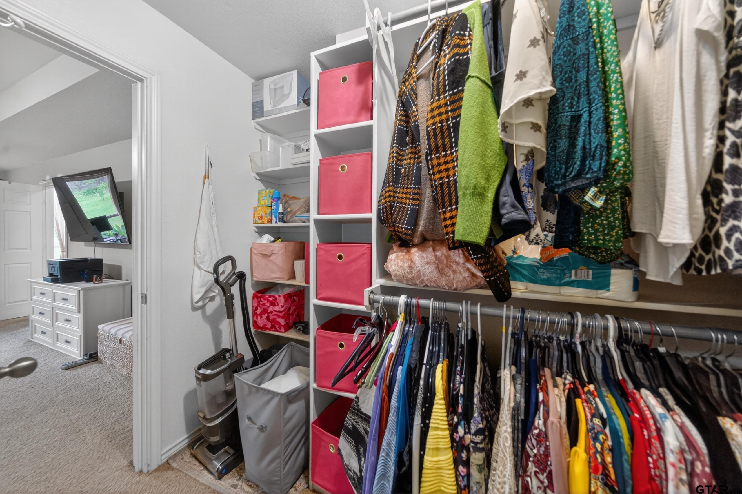 11274 Meadows Drive Flint, TX 75762 - Photo 20 of 43 a view of walk in closet with clothes