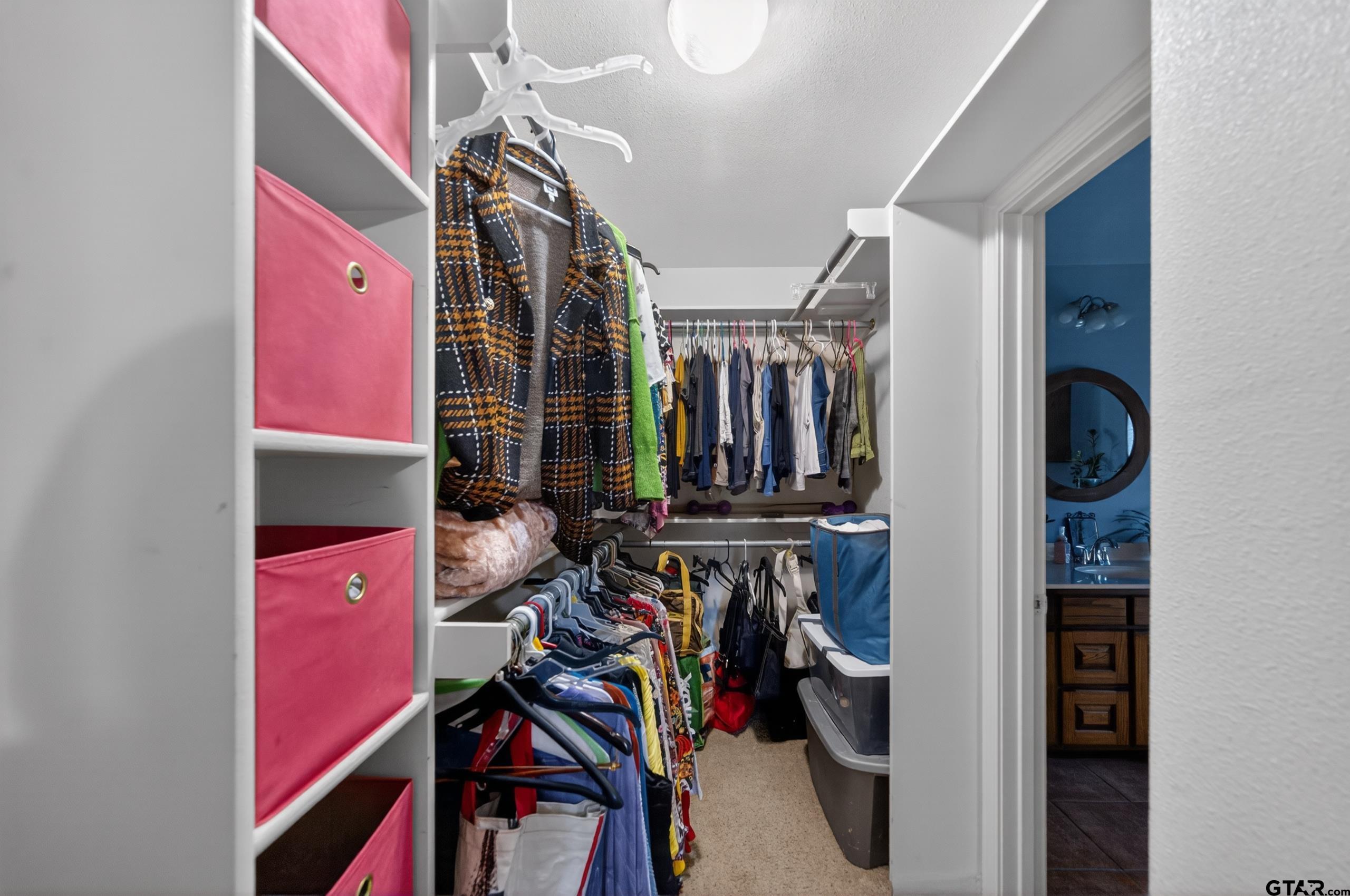 11274 Meadows Drive Flint, TX 75762 - Photo 22 of 43 a view of walk in closet with clothes and shoes
