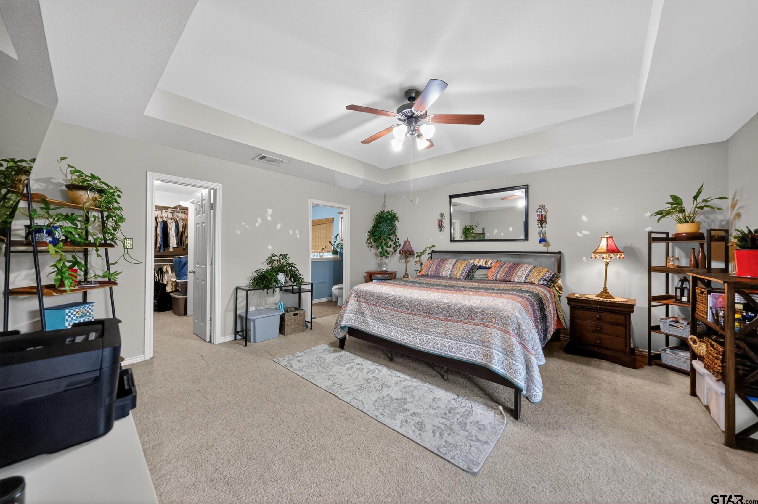 11274 Meadows Drive Flint, TX 75762 - Photo 25 of 43 a bedroom with a bed furniture and a chandelier