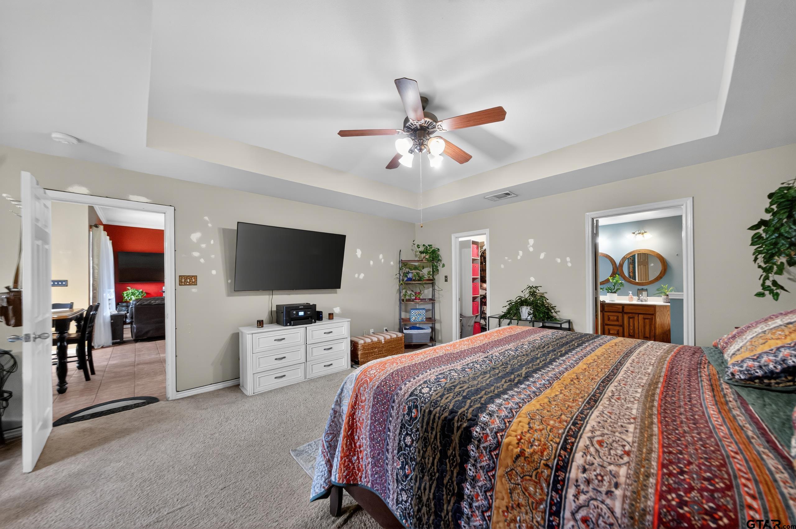 11274 Meadows Drive Flint, TX 75762 - Photo 26 of 43 a bedroom with a bed and a flat screen tv
