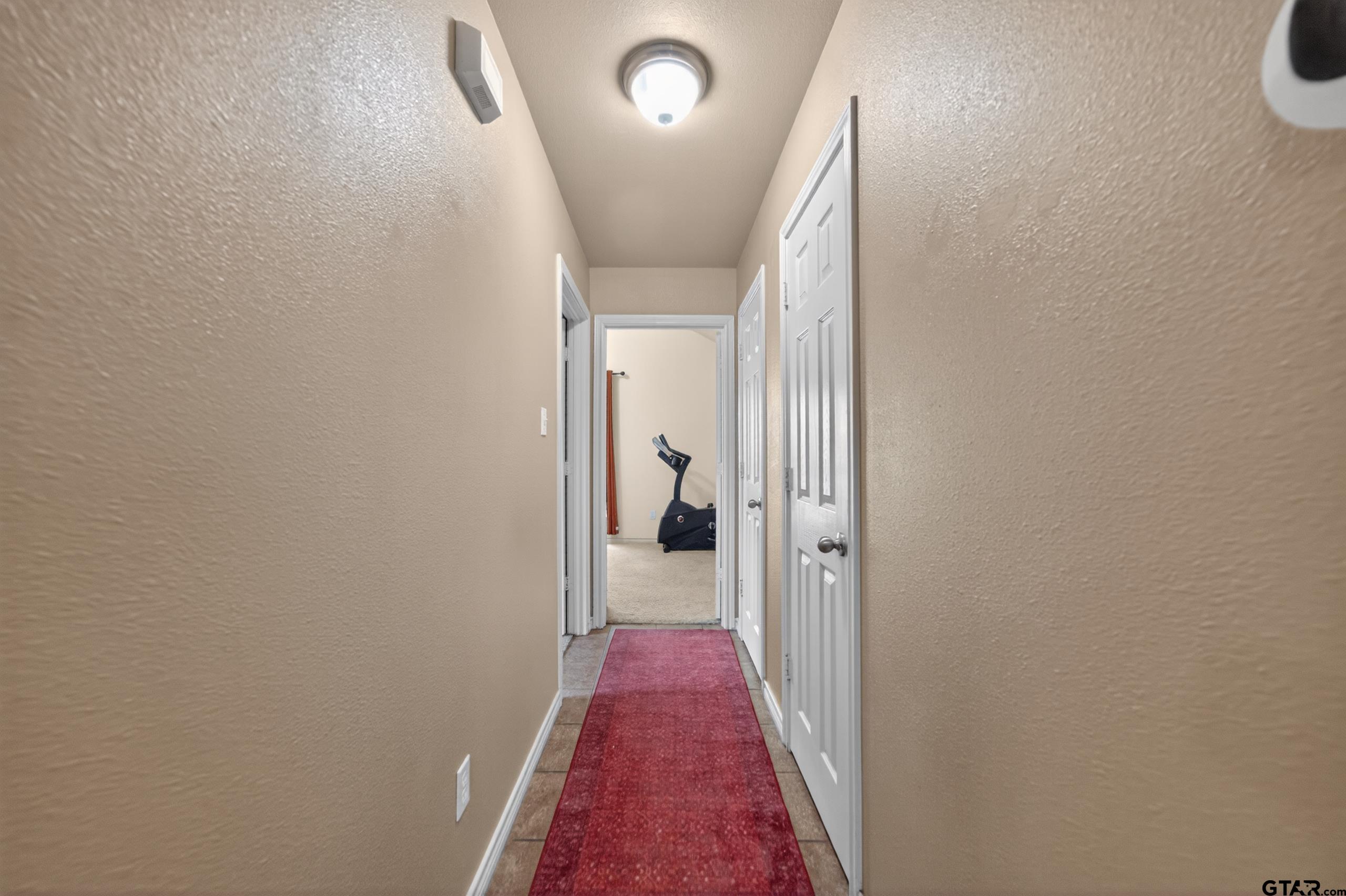 11274 Meadows Drive Flint, TX 75762 - Photo 27 of 43 a view of hallway with wooden floor