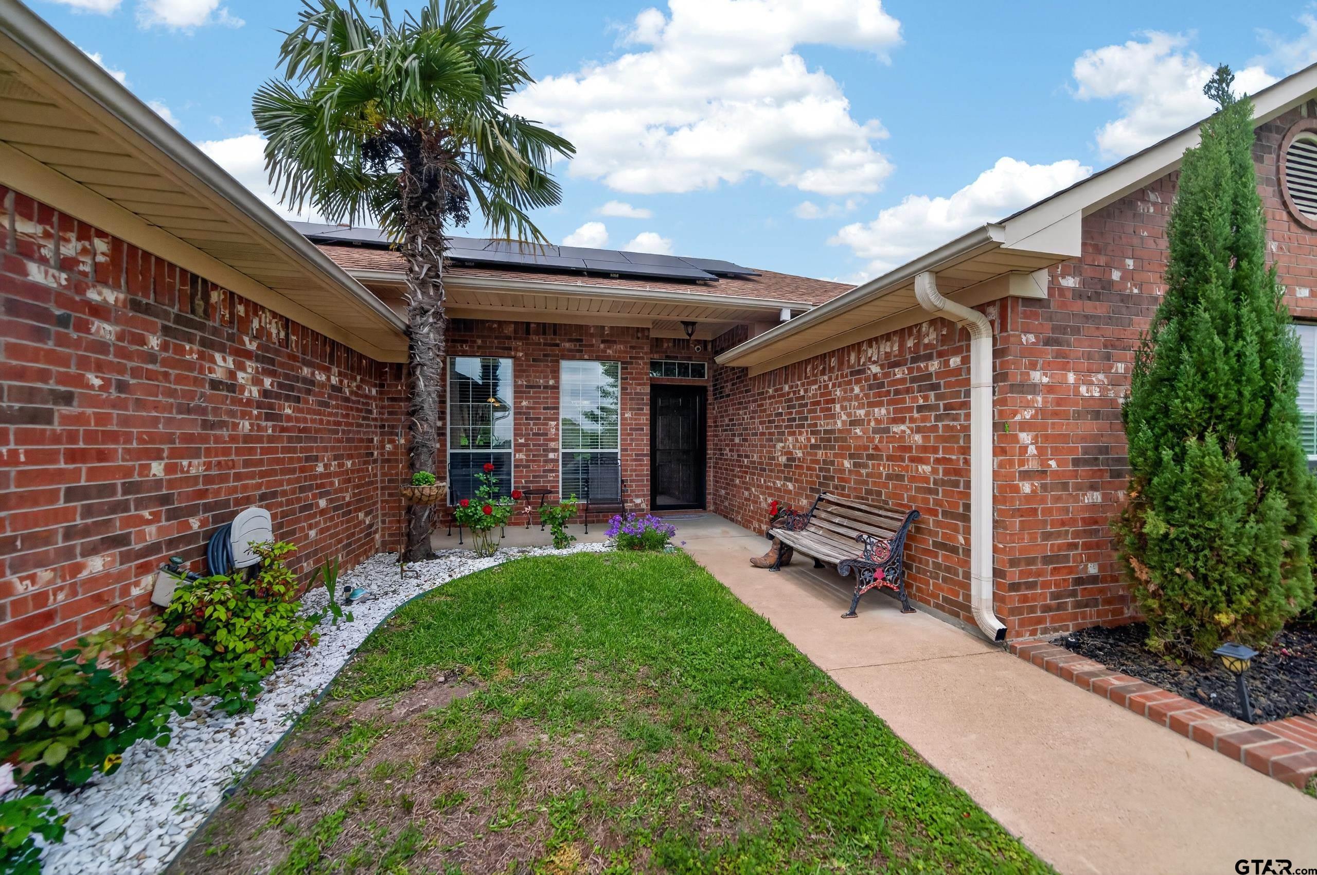 11274 Meadows Drive Flint, TX 75762 - Photo 3 of 43 a front view of a house with garden