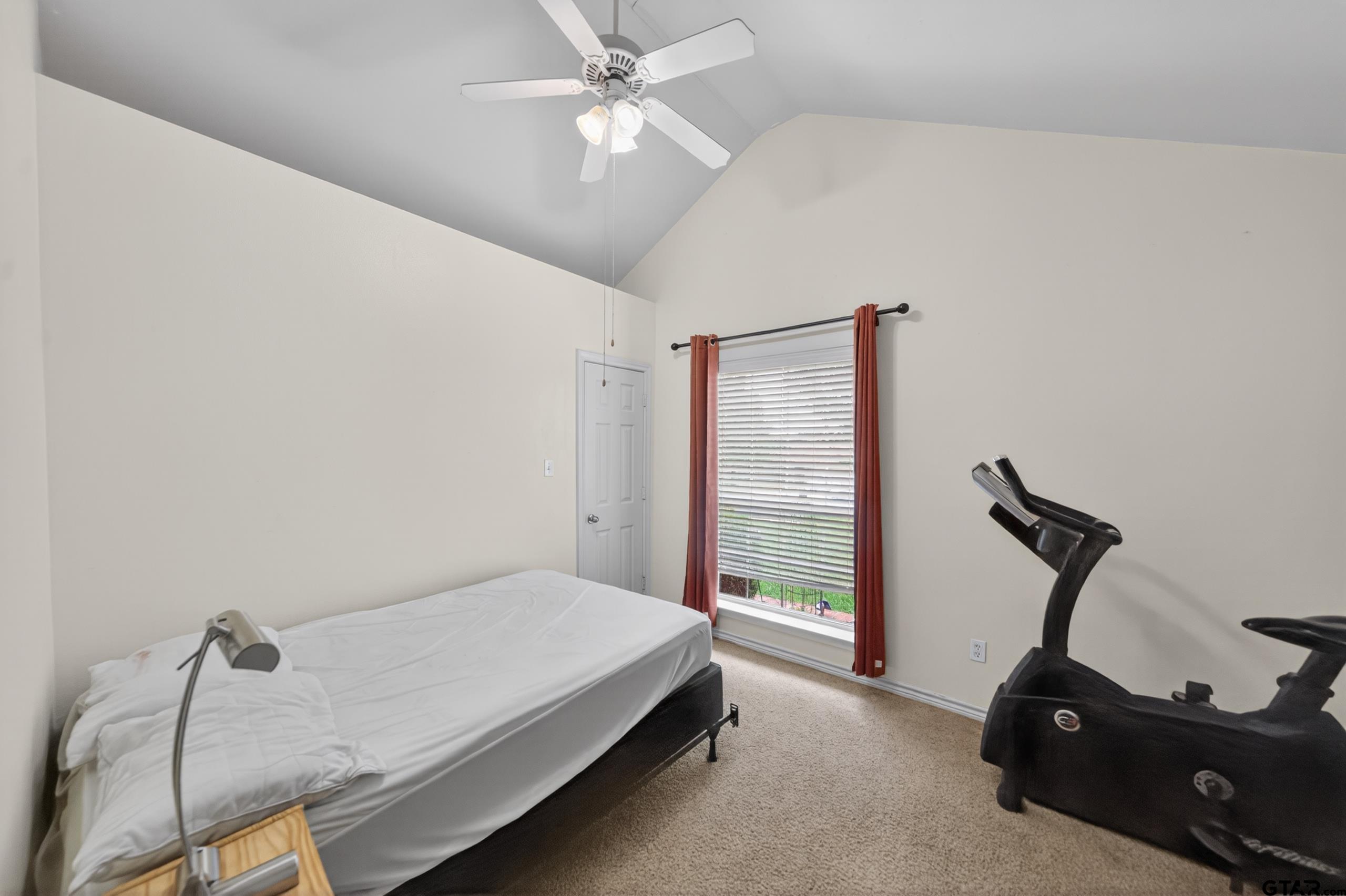 11274 Meadows Drive Flint, TX 75762 - Photo 31 of 43 a bedroom with a bed and a ceiling fan