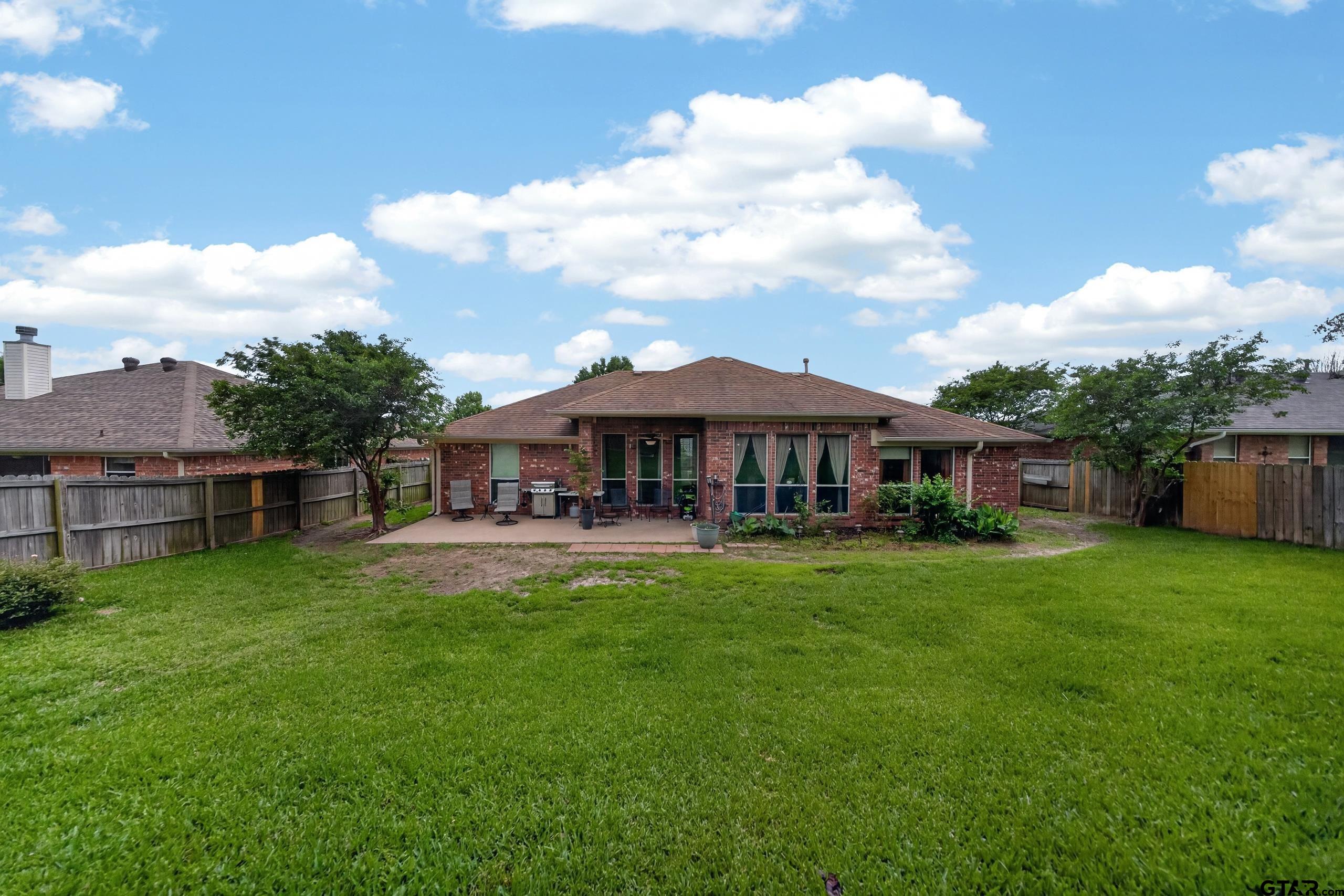 11274 Meadows Drive Flint, TX 75762 - Photo 41 of 43 a view of a house with backyard sitting area and garden