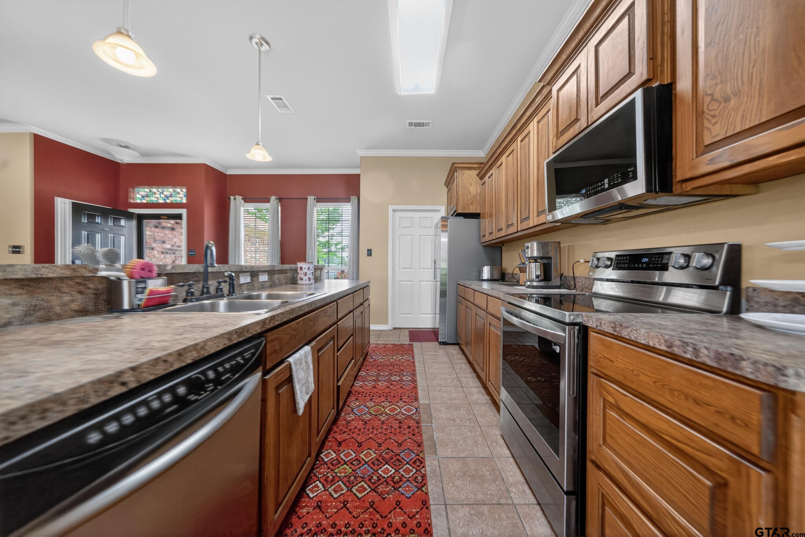 11274 Meadows Drive Flint, TX 75762 - Photo 9 of 43 a large kitchen with stainless steel appliances granite countertop a lot of counter space
