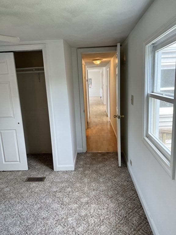 270 Littleton Road, Unit 109 Chelmsford, MA 01824 - Photo 12 of 41 an empty room with windows