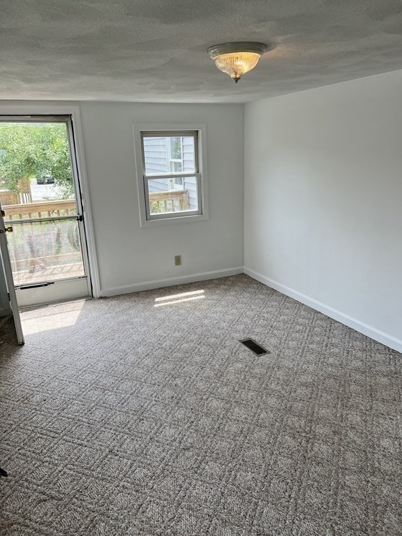 270 Littleton Road, Unit 109 Chelmsford, MA 01824 - Photo 16 of 41 an empty room with a window