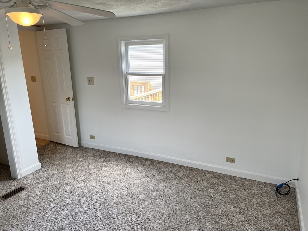 270 Littleton Road, Unit 109 Chelmsford, MA 01824 - Photo 19 of 41 an empty room with window
