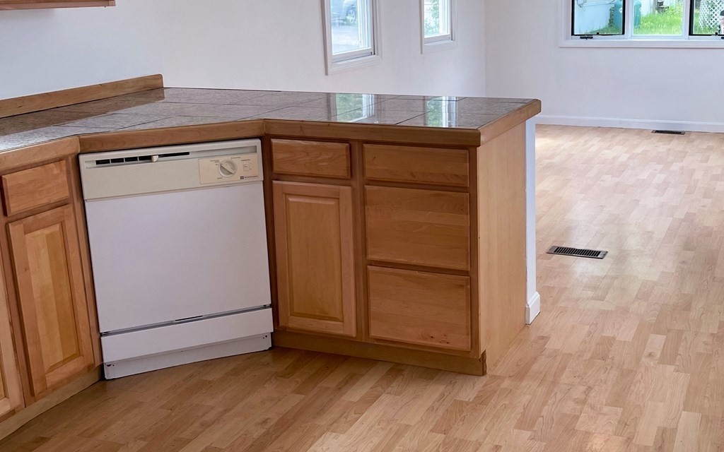 270 Littleton Road, Unit 109 Chelmsford, MA 01824 - Photo 2 of 41 a utility room with washer and dryer