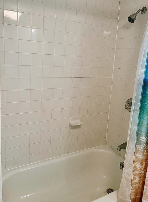 270 Littleton Road, Unit 109 Chelmsford, MA 01824 - Photo 25 of 41 a bathroom with a bathtub