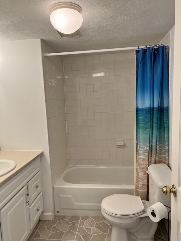 270 Littleton Road, Unit 109 Chelmsford, MA 01824 - Photo 26 of 41 a bathroom with a toilet and a shower