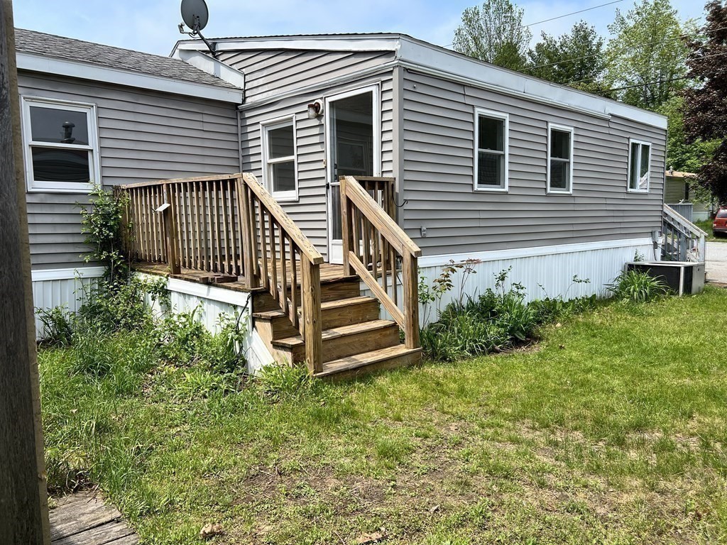 270 Littleton Road, Unit 109 Chelmsford, MA 01824 - Photo 33 of 41 a view of a house with backyard and garden